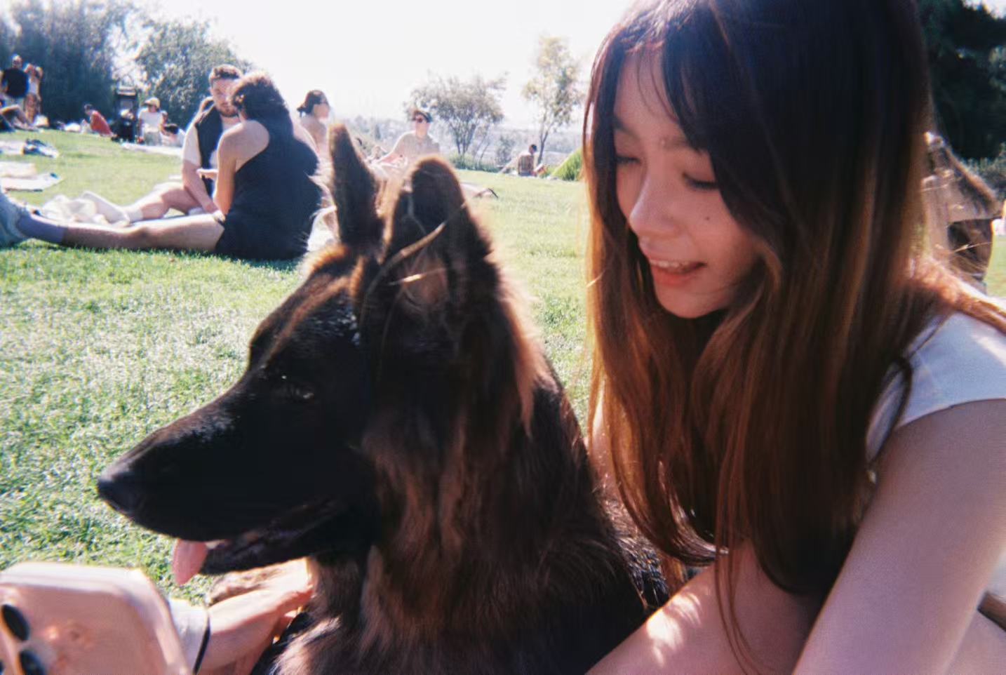Charlotte Gao spending time outdoors with a dog